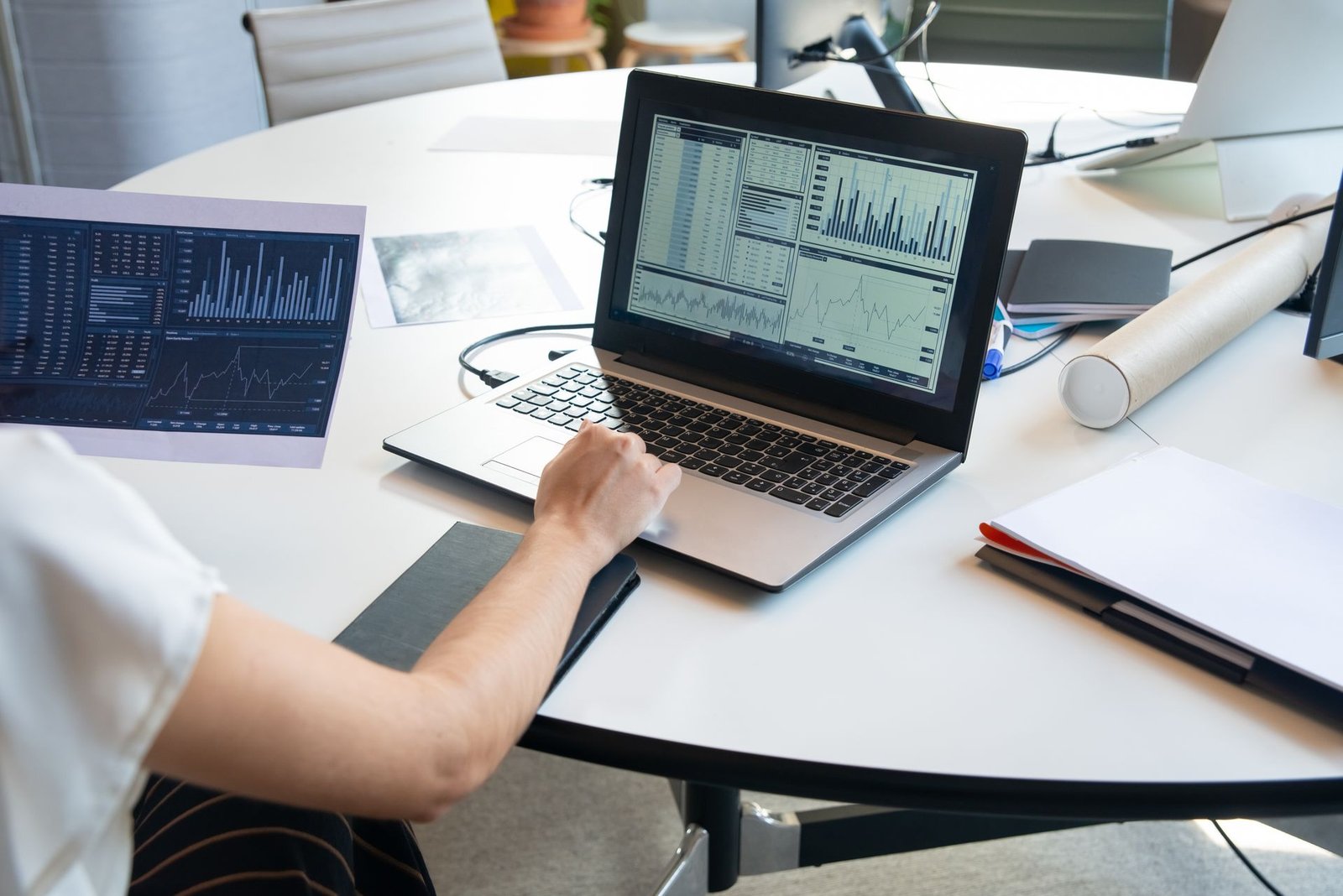 Analyst reviewing a dashboard on a laptop